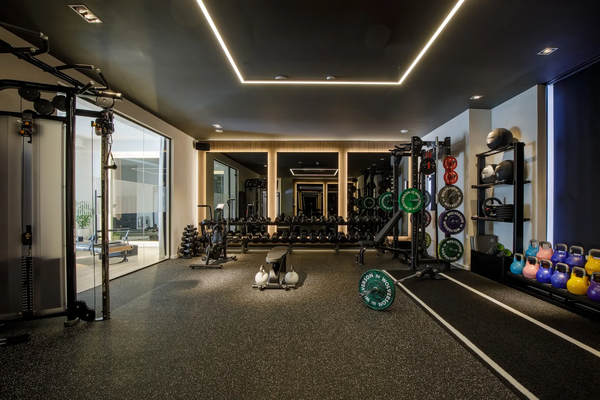State-of-the-art fitness center with weights, kettlebells, and strength training equipment.